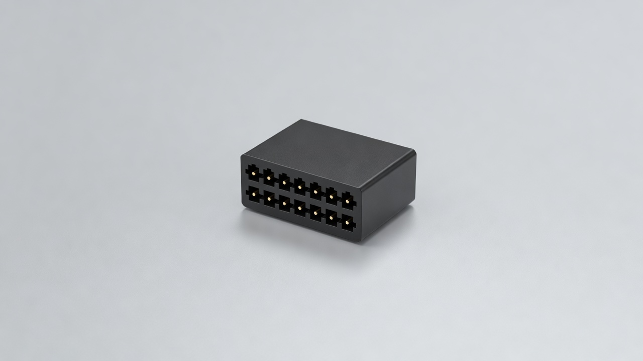 Soft-lit 3D render of a generic 16-pin trapezoidal diagnostic connector on a pale grey surface